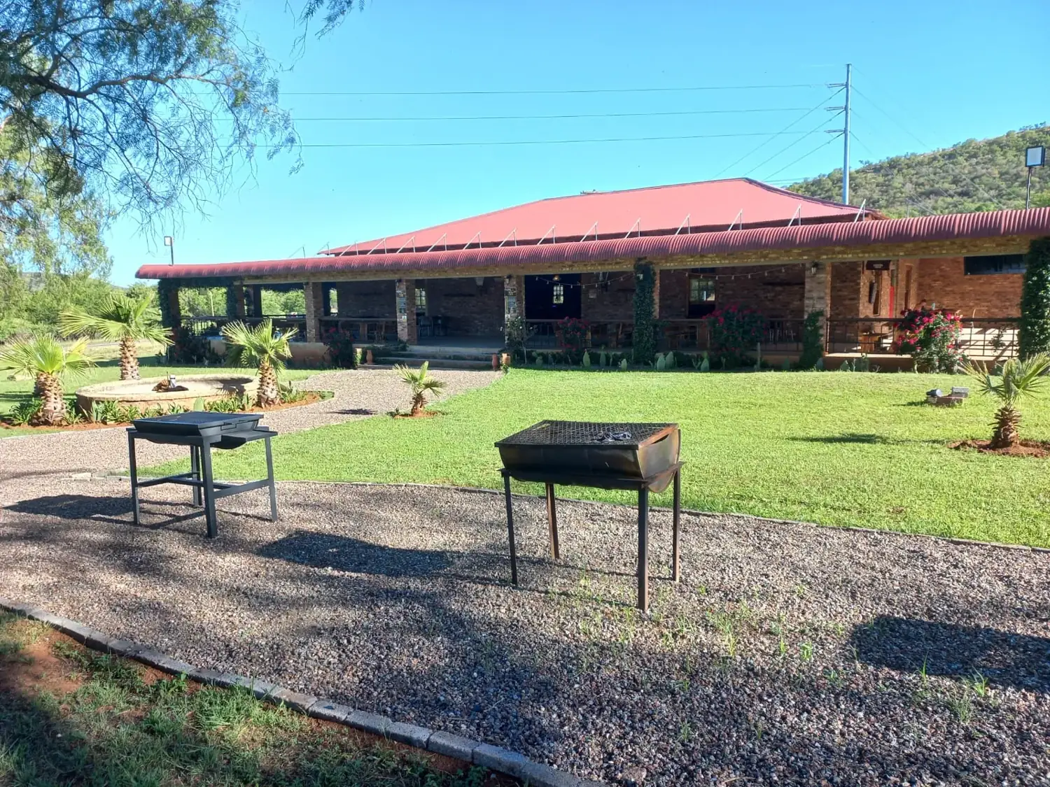 Braai stands on the lawn in front of the saloon