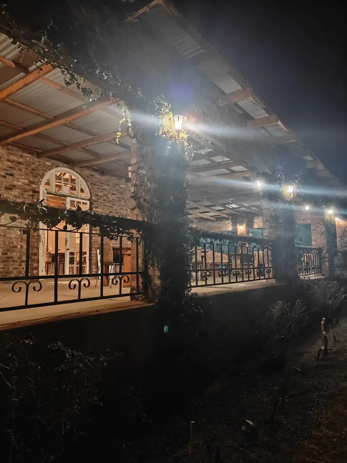 The Longhorn Saloon veranda lit up at night